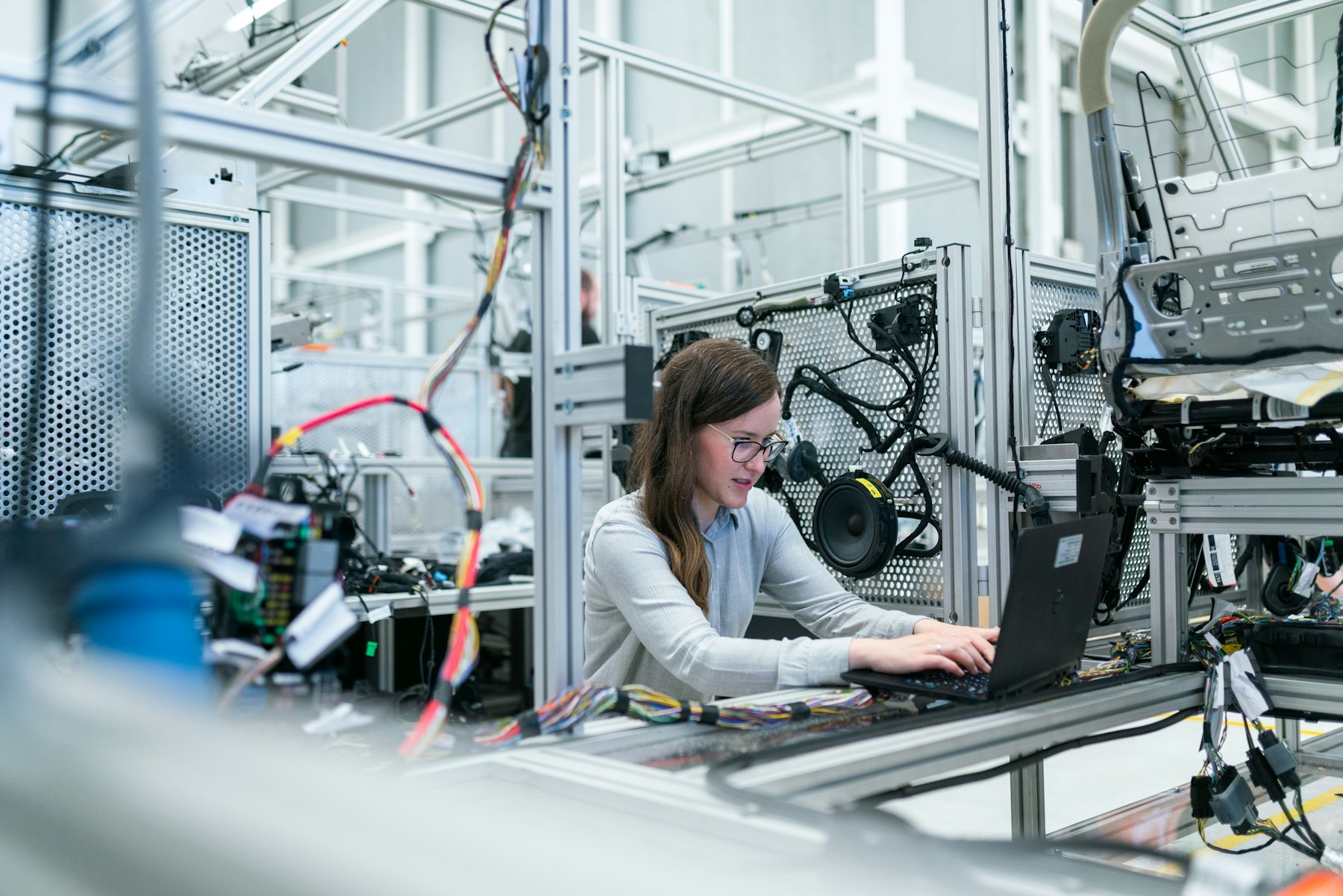 Worker operating equipment on a production floor